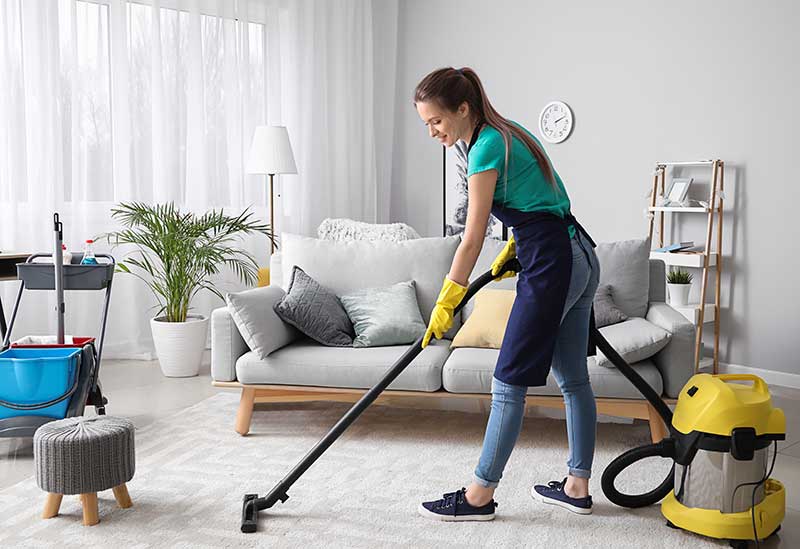 House cleaning vacuuming living room
